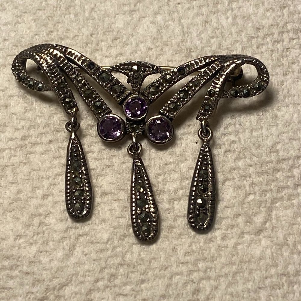 Sterling silver brooch with amethysts
